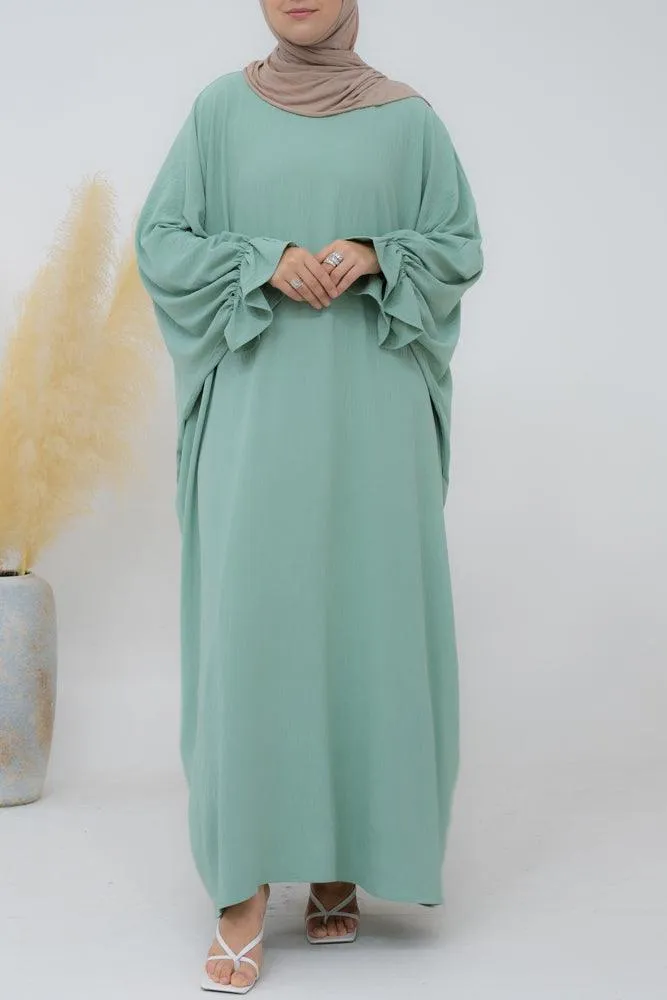 Radwa batwing abaya with ruched sleeve and loose cut in mint green