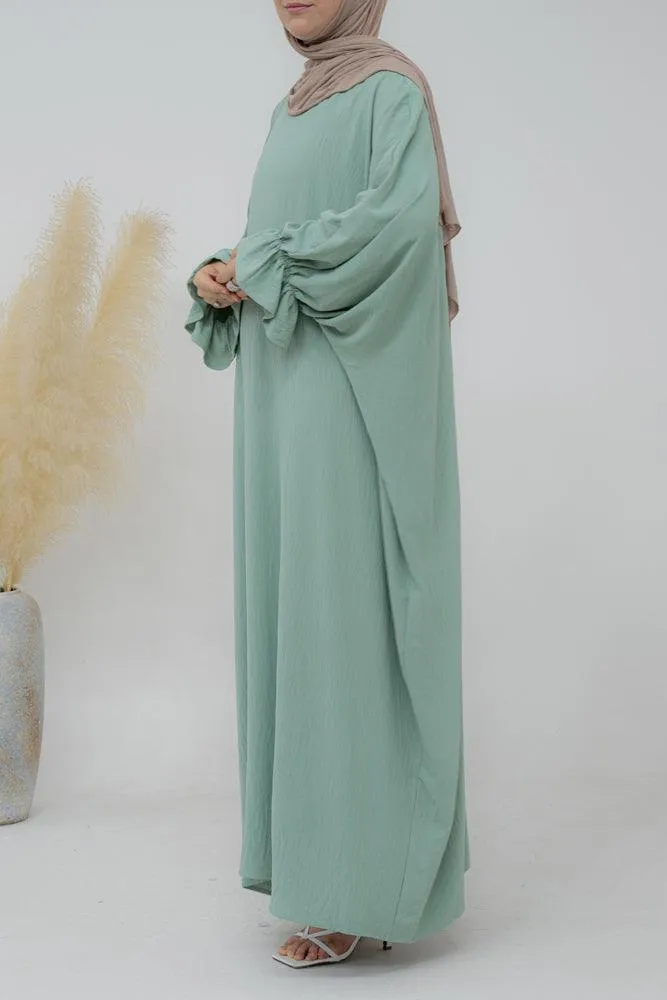 Radwa batwing abaya with ruched sleeve and loose cut in mint green