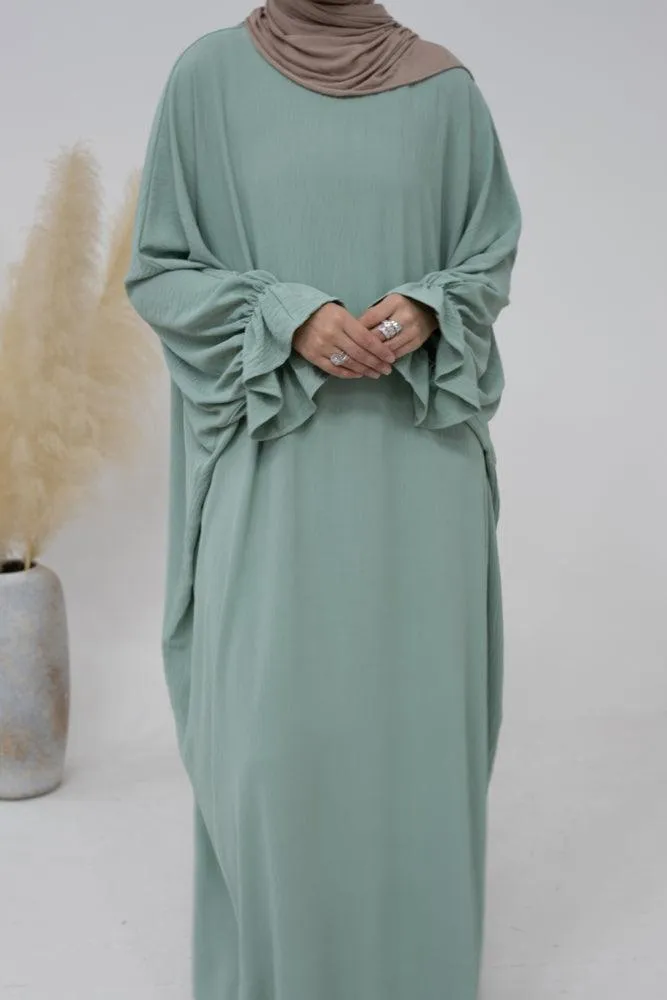 Radwa batwing abaya with ruched sleeve and loose cut in mint green