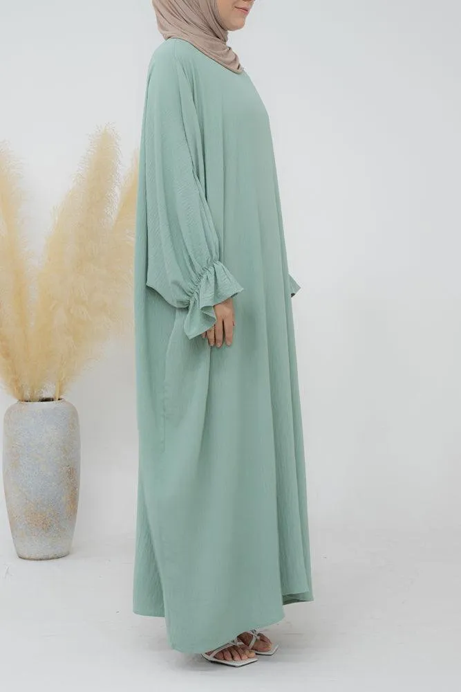 Radwa batwing abaya with ruched sleeve and loose cut in mint green