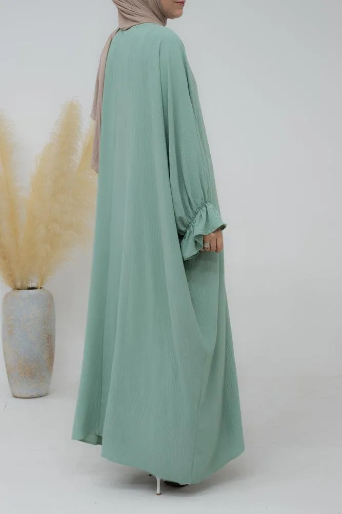 Radwa batwing abaya with ruched sleeve and loose cut in mint green